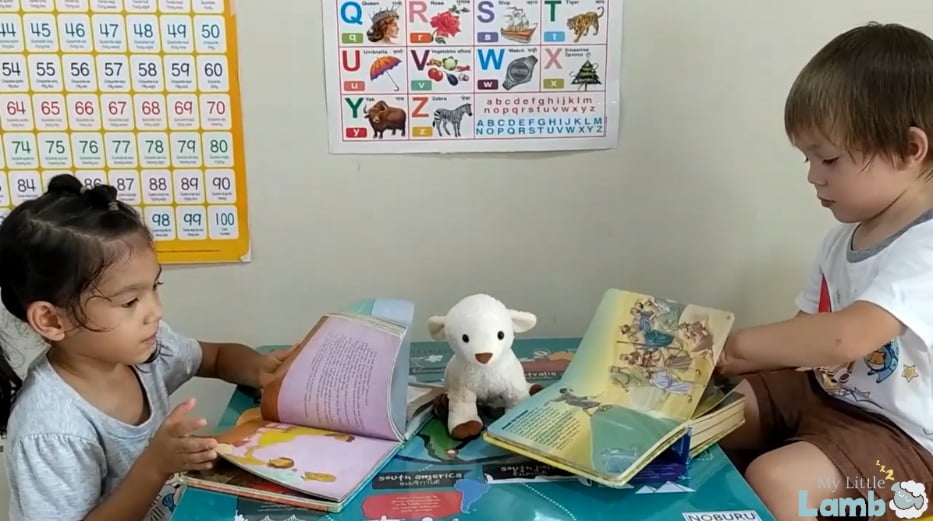 Little Boy and Girl reading Bible stories with My Little Lamb, a soft toy with integrated audio player